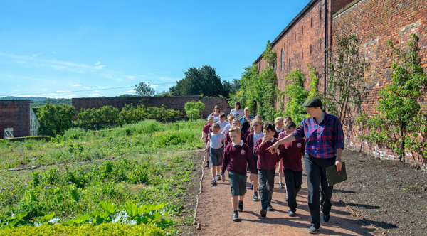 A group of primary school students on a guided tour of Cannon Hall Museum, Park and Gardens