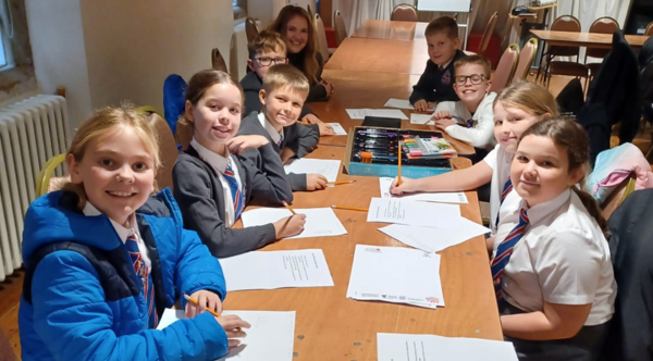 A group of primary school students taking part in a craft activity