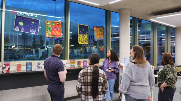 People Enjoying The Art Installation At Library @ The Lightbox