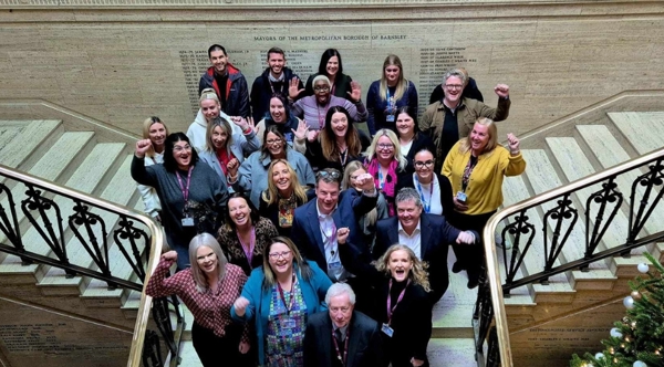 Team Standing On The Town Hall Staircase