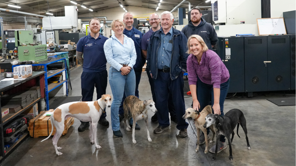 Group of people stood with their dogs