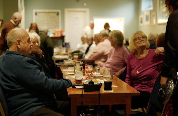 A Scene From A Town I Love So Well Showing People In A Social Club