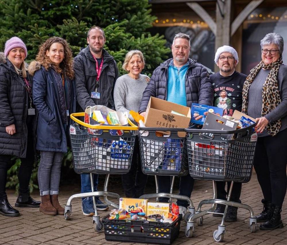 People Stood With Trolleys