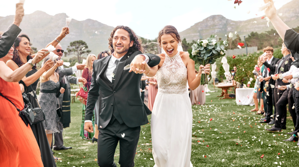 A Couple Celebrating Their Wedding With Family